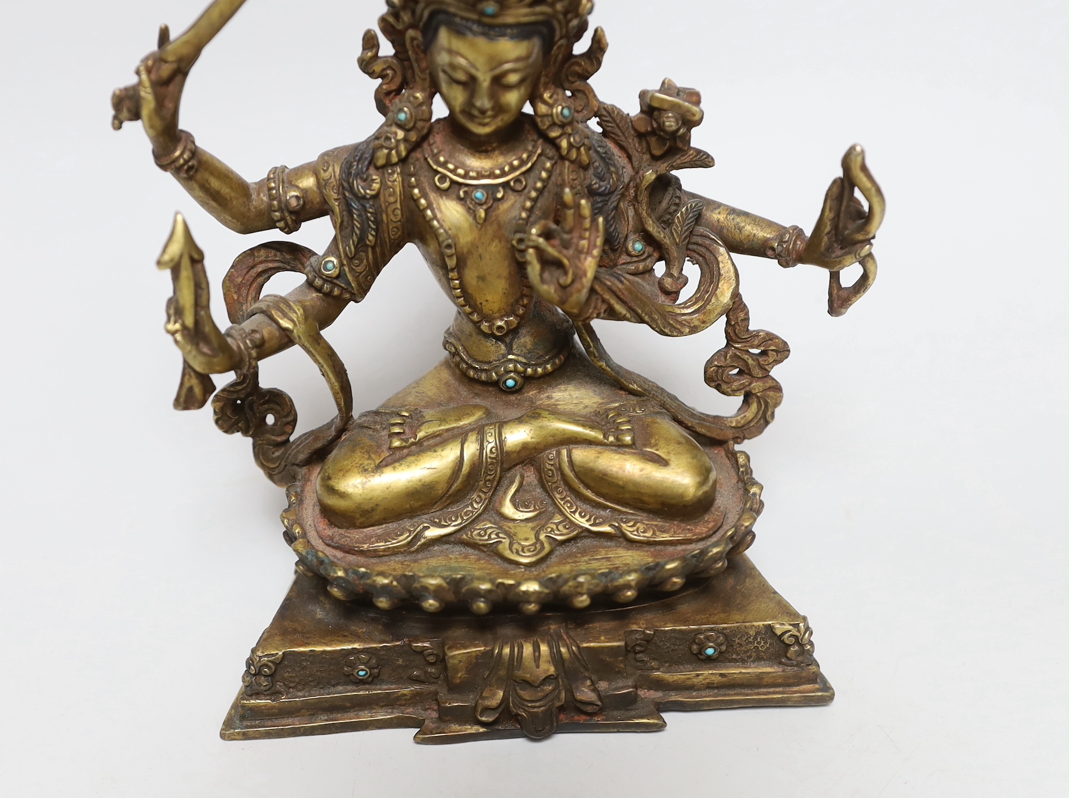 A Sino-Tibetan bronze figure of Avolekshvara, 17cm high